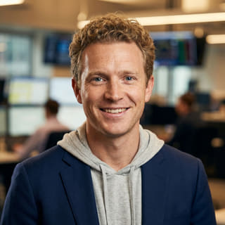 Photo of Ryan Brooks, identified as Lead Trading Analyst at Wveltrion